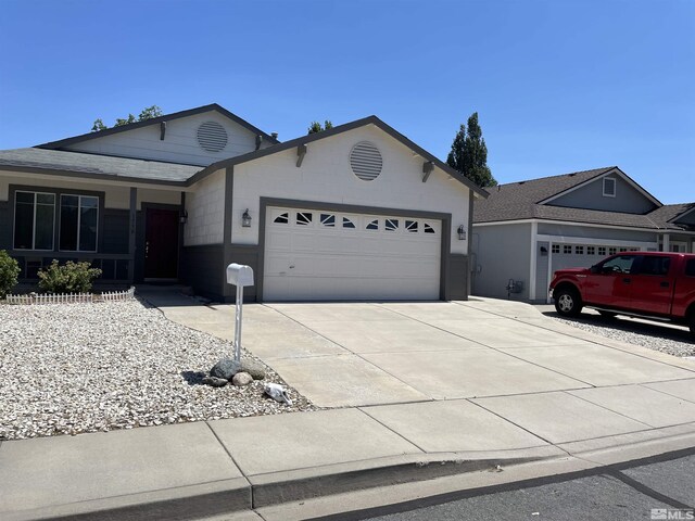 ranch-style home featuring a garage