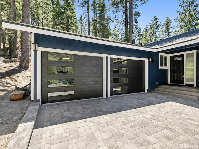 view of exterior entry featuring a garage