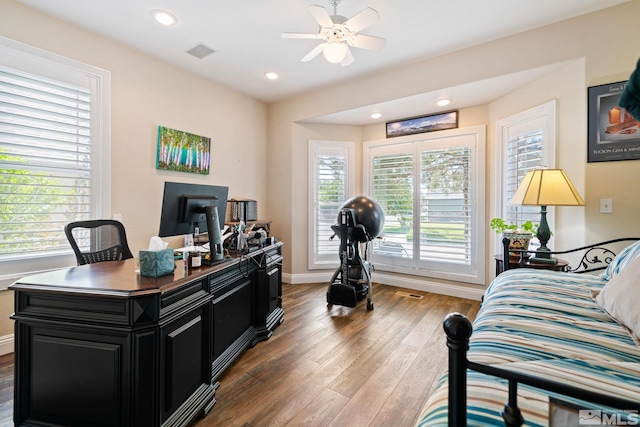 office area with recessed lighting, wood finished floors, a ceiling fan, visible vents, and baseboards