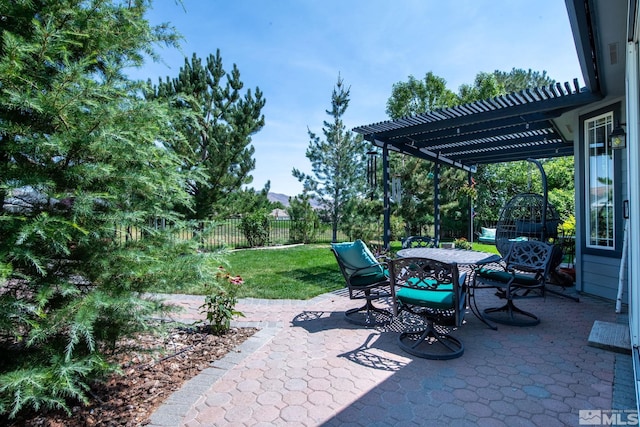 view of patio / terrace with a fenced backyard, a pergola, and outdoor dining space