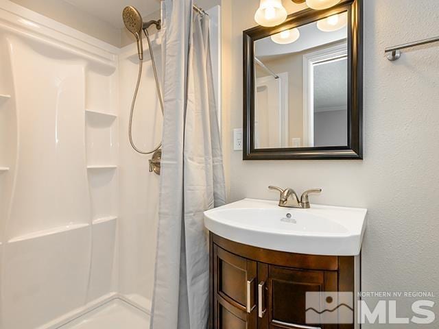 bathroom with vanity and a shower with curtain