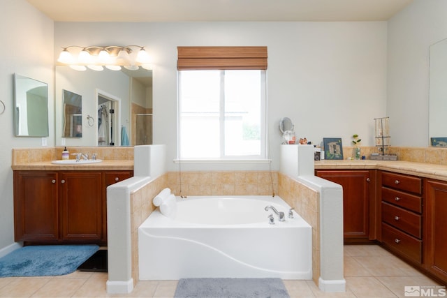 bathroom with vanity, tile patterned floors, and a bathtub