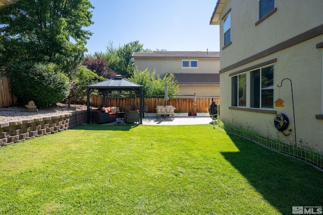 view of yard featuring a patio area, a gazebo, and an outdoor hangout area