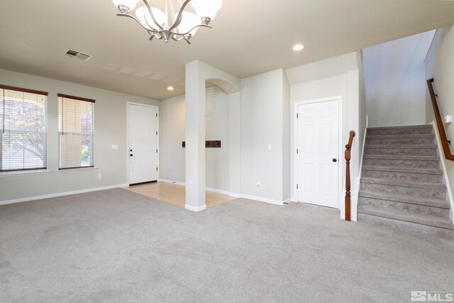 kitchen with white cabinets, a kitchen island, stainless steel appliances, light hardwood / wood-style floors, and sink