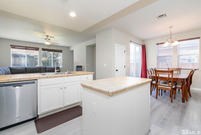 carpeted living room with ceiling fan