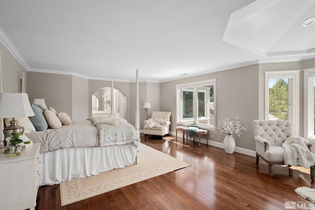 bedroom featuring crown molding and dark hardwood / wood-style flooring