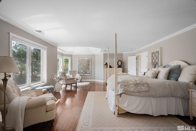 bedroom with crown molding and hardwood / wood-style floors