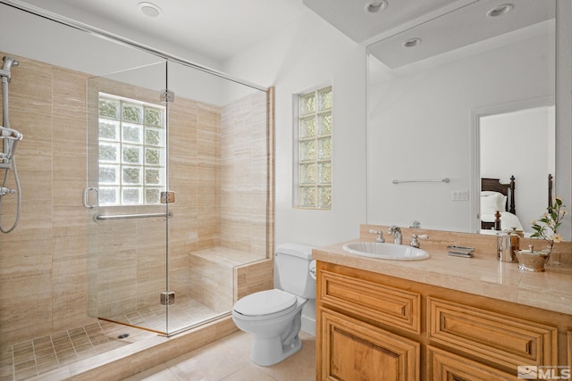 bathroom with vanity, tile patterned floors, an enclosed shower, and toilet