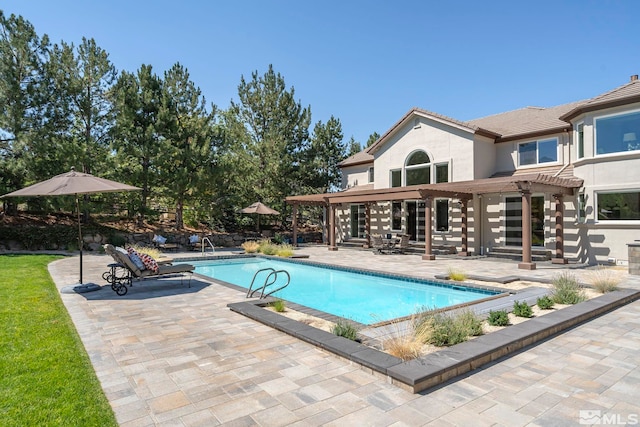 view of pool with a patio and a pergola