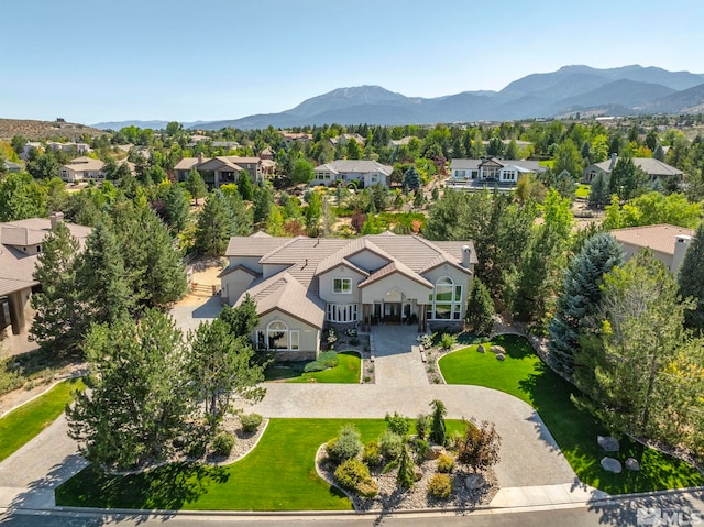 birds eye view of property with a mountain view