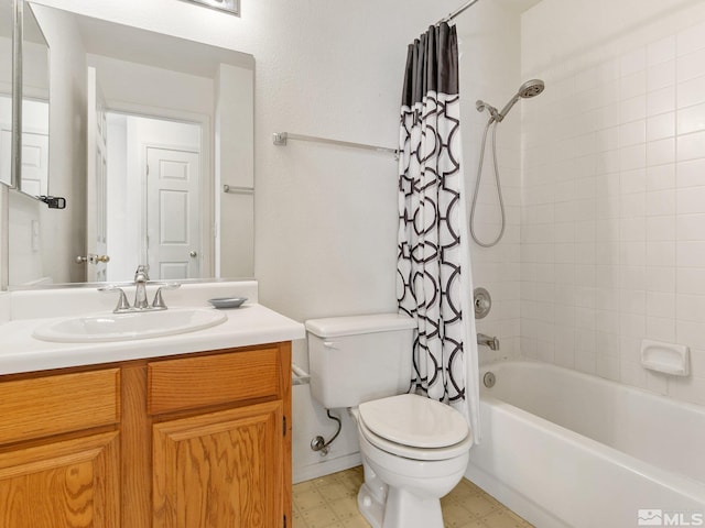 bathroom with tile patterned floors, vanity, toilet, and shower / tub combo