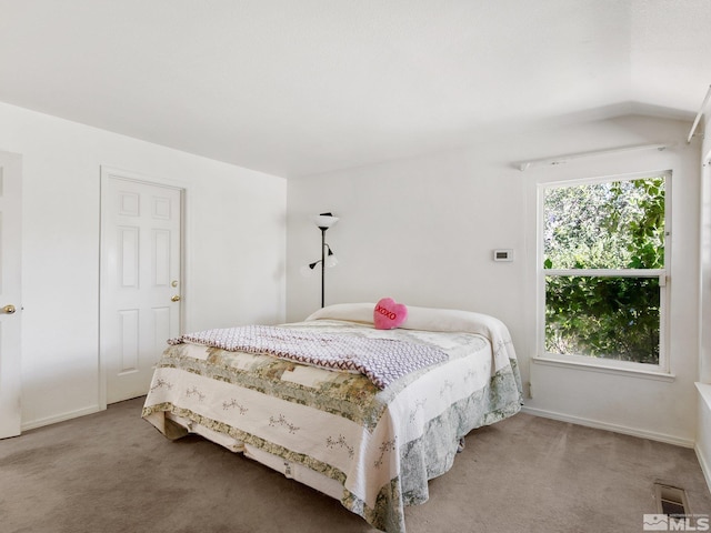 carpeted bedroom with baseboards and visible vents