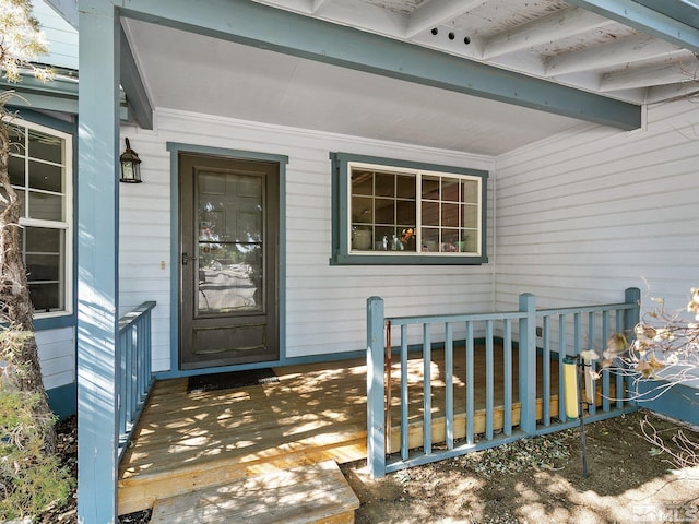 doorway to property with a deck