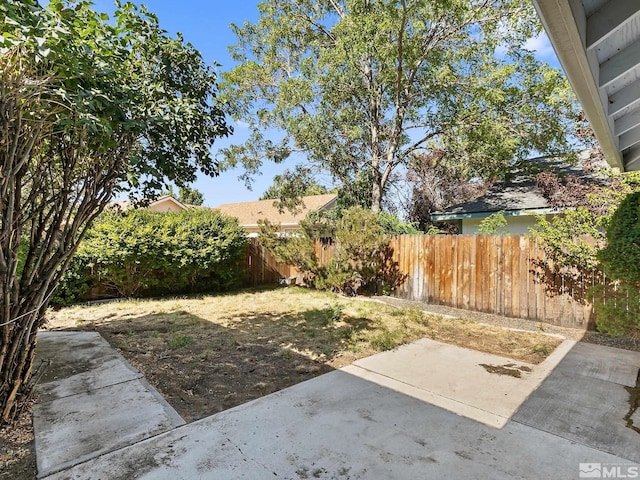 view of yard with fence private yard and a patio