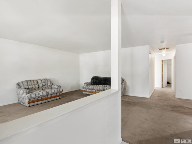 interior space featuring visible vents and carpet floors