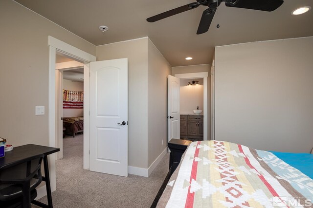 bedroom with carpet flooring, ensuite bathroom, and ceiling fan