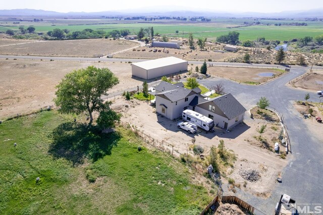 birds eye view of property featuring a rural view