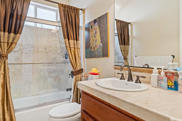 full bathroom featuring vanity, toilet, and shower / tub combo