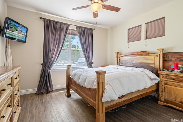 bedroom featuring dark wood-type flooring and ceiling fan