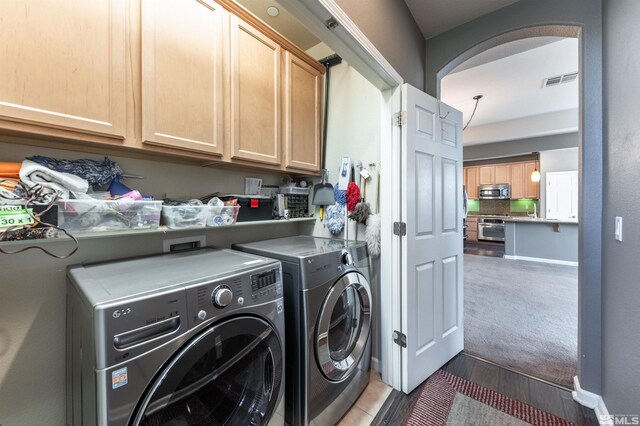 kitchen featuring sink, decorative light fixtures, a raised ceiling, and ceiling fan