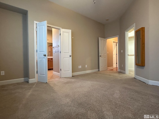 unfurnished bedroom featuring light colored carpet