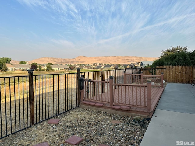 view of gate with a mountain view