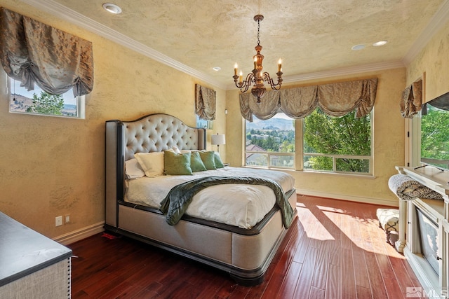 bedroom featuring ornamental molding, a notable chandelier, and hardwood / wood-style flooring