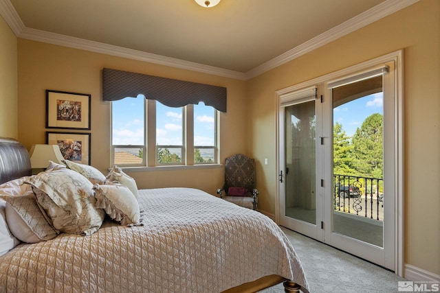 carpeted bedroom featuring ornamental molding and access to exterior