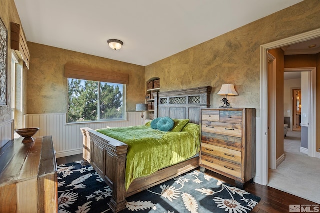 bedroom with hardwood / wood-style floors