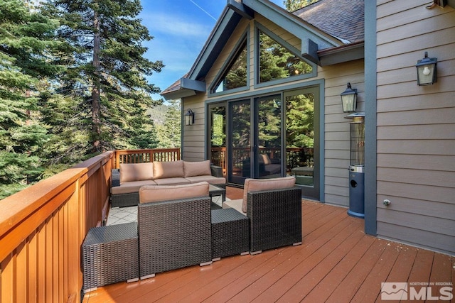 wooden deck featuring an outdoor hangout area