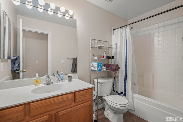 full bathroom featuring vanity, shower / bath combo with shower curtain, wood-type flooring, and toilet