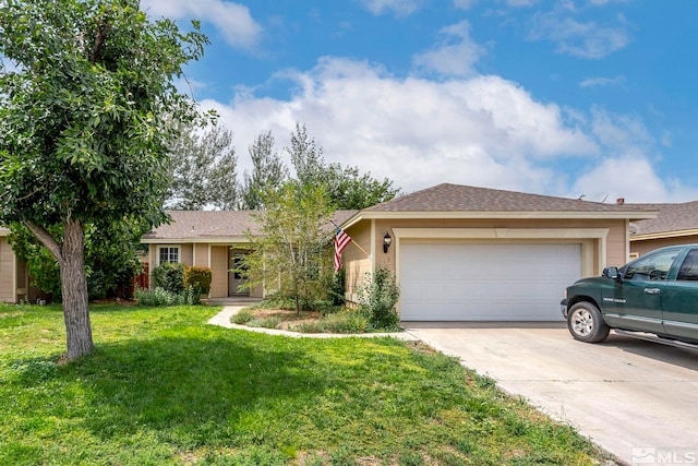 ranch-style house featuring a garage and a front lawn