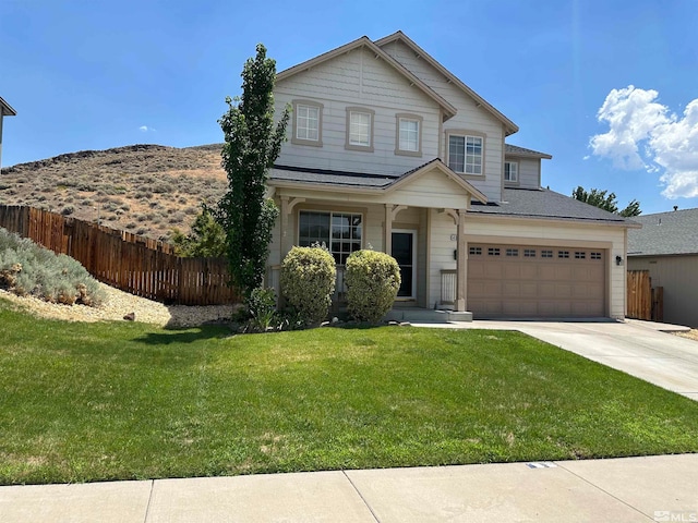 view of front facade featuring a front lawn and a garage