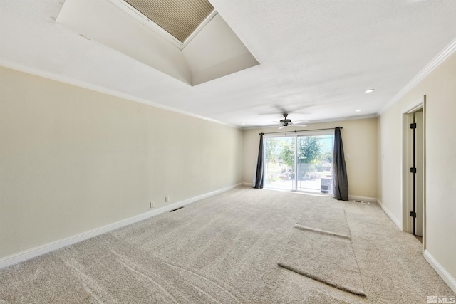 unfurnished room featuring light carpet, crown molding, and ceiling fan