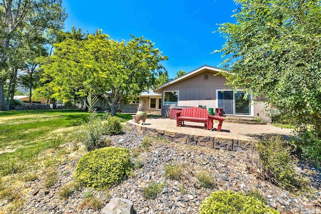 rear view of house with a yard