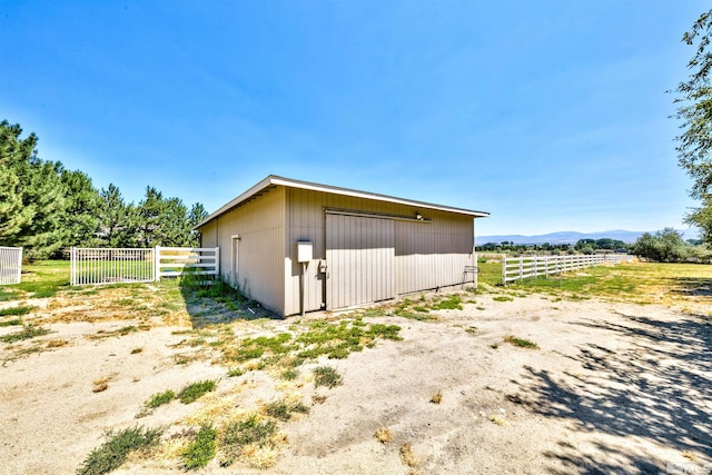 view of outbuilding with a rural view