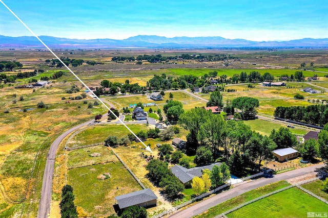 birds eye view of property with a mountain view