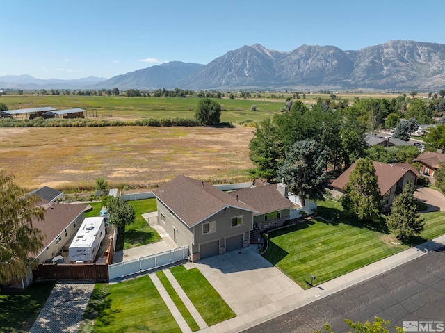 drone / aerial view with a mountain view and a rural view