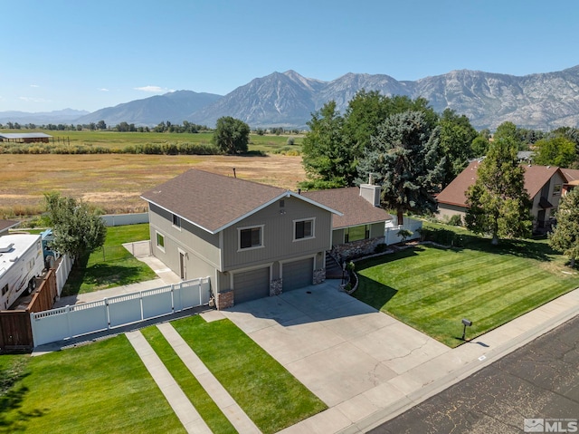 aerial view featuring a rural view and a mountain view