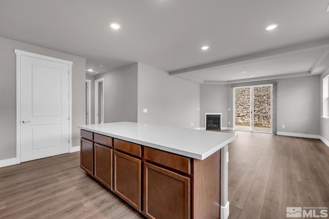 kitchen featuring a center island and light hardwood / wood-style floors