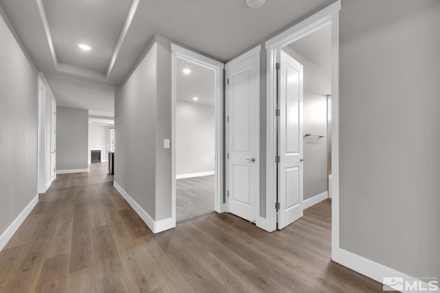 corridor featuring light hardwood / wood-style flooring