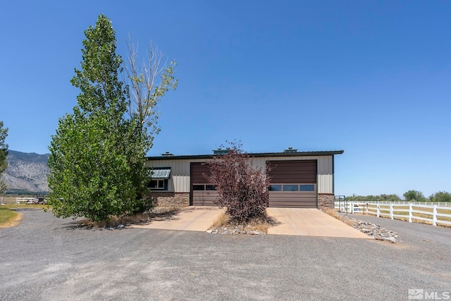 view of front of house with a mountain view and a garage