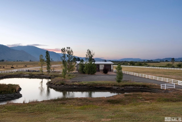 view of water feature with a mountain view and a rural view