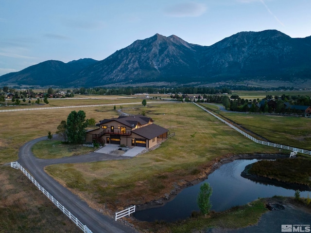 view of mountain feature with a water view and a rural view