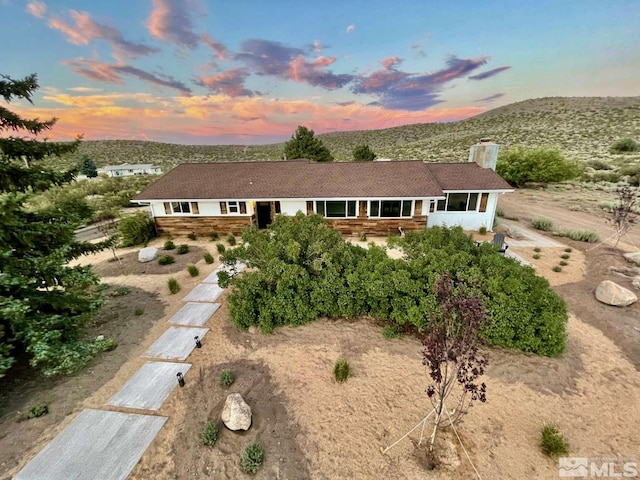 view of front facade featuring a mountain view