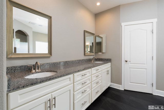 bathroom with vanity and hardwood / wood-style flooring