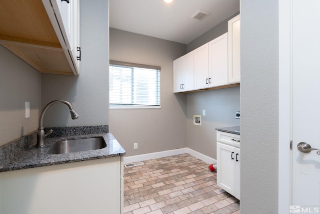 laundry room featuring cabinets, hookup for an electric dryer, hookup for a washing machine, and sink