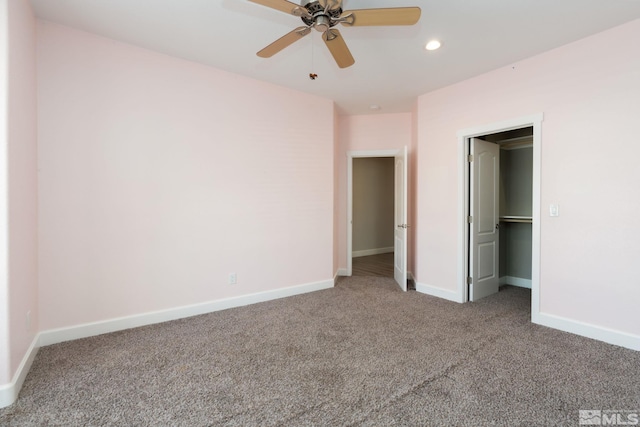 unfurnished bedroom with ceiling fan and carpet floors