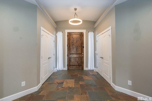 entryway featuring vaulted ceiling