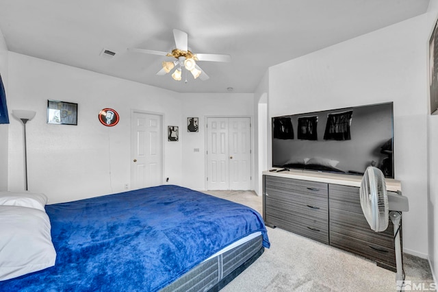 bedroom with light carpet and ceiling fan